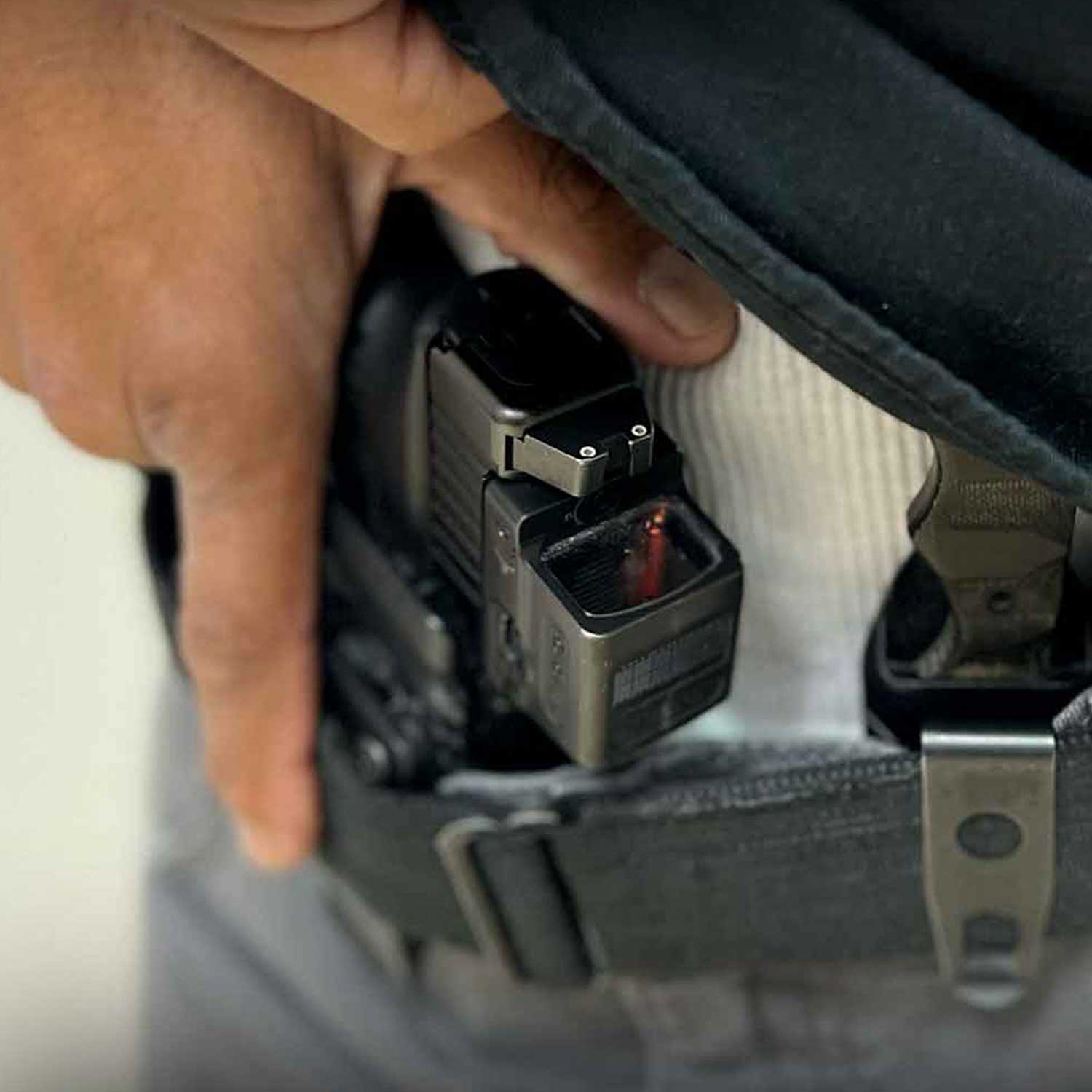 New York Concealed Carry Holster Draw Training Concealed carry holster with handgun being drawn during New York CCW training