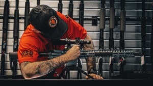 Gun For Hire staff preparing a rifle rental